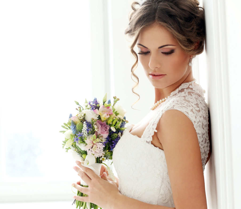 Wedding. Beautiful bride with bouquet